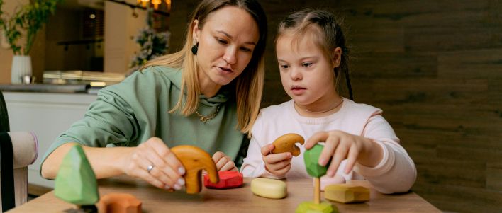 A Mother and Girl Playing Toys Together